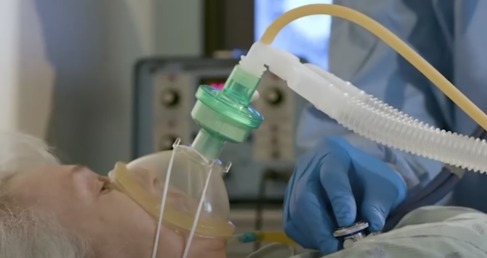 Elderly woman with oxygen tube on her nose