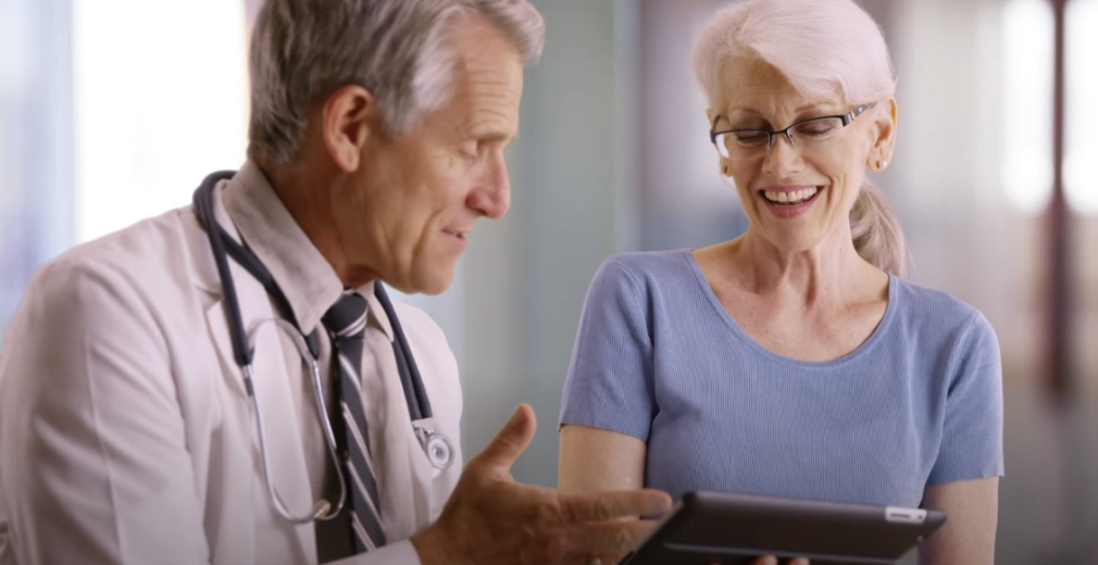 Elderly woman having a conversation with a doctor.