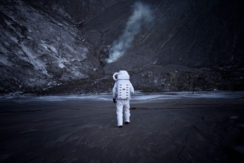 An astronaut walks on the planet